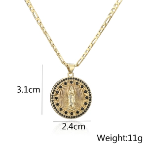 Detail view of 18K gold plated Virgin Mary pendant with black zircon stones and Figaro chain