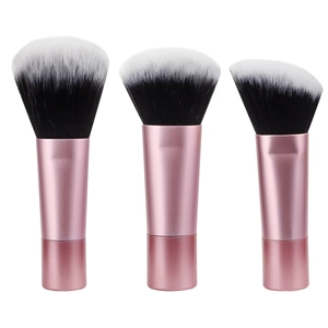 Detailed close-up of three pink makeup brushes with black and white gradient soft bristles