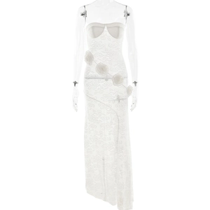Close-up of white lace dress with 3D floral appliques and sheer mesh texture