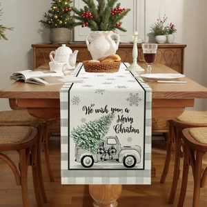 Christmas table runner with vintage truck and tree print on wooden dining table