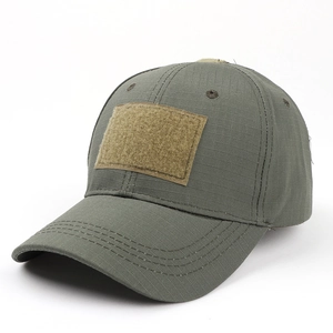 Close-up of olive tactical baseball cap with ripstop fabric and front velcro patch area