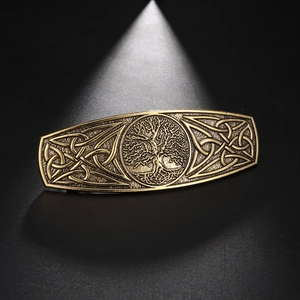 Detailed view of vintage bronze Tree of Life hair clip with intricate Celtic knot designs