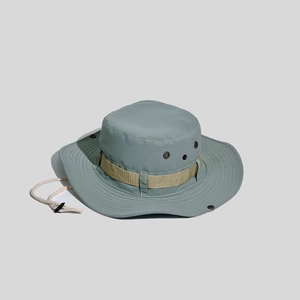 Detail view of outdoor sun hat featuring side ventilation eyelets and adjustable wind cord