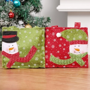 Christmas felt gift bags with snowman embroidery and festive snowflake prints