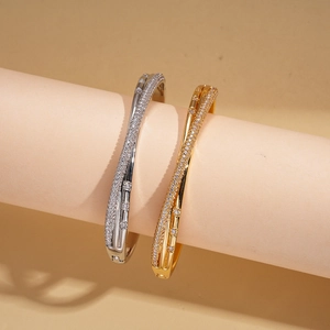 18k gold plated criss-cross cuff bracelets with zircon inlay in gold and silver finish