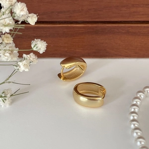 Chic 925 sterling silver gold-plated thick hoop earrings on elegant minimalist display