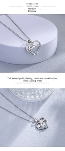Detail of silver Mama heart pendant with rhinestones and thick gold plating finish