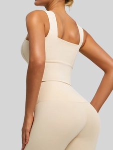 Beige high-impact sports bra and leggings set with wide straps and racerback design