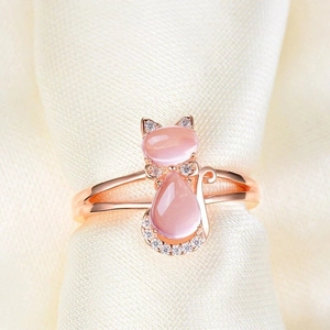 Elegant rose gold cat ring featuring pink quartz stones and sparkling diamond accents