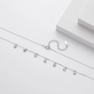 Detail of S925 sterling silver necklace showing the 925 hallmark and zircon charms
