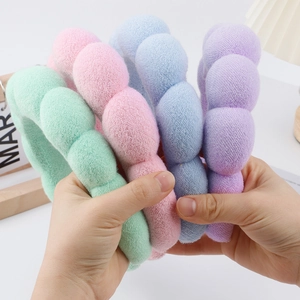 Plush bubble headbands in pastel mint, pink, blue and purple for face washing
