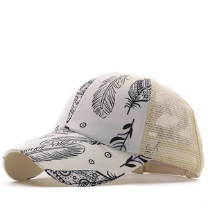 Detail of mesh ponytail hat with feather print and ethnic geometric pattern on the visor