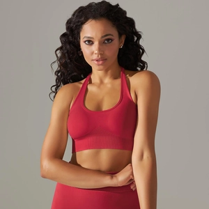 Detail of seamless magenta sports bra with wide ribbed elastic band and racerback design