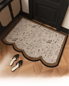 Detail of vintage French floral PVC doormat showing woven texture and wavy edges
