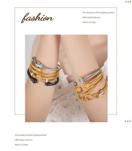 Detail view of multi-color cable wire bangles with zircon accents and hook clasp