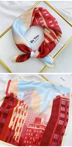 Detail of satin silk scarf with modern city architecture prints in vibrant color blocking