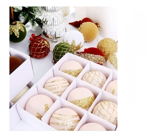 Detail of Christmas balls with velvet texture, gold glitter and mesh in festive setting