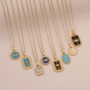 Star Moon and Evil Eye pendant necklaces in gold stainless steel with enamel designs