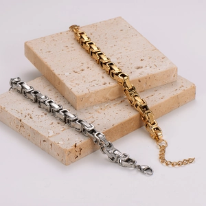 Polished hip-hop square link bracelet in gold and silver steel on stone blocks