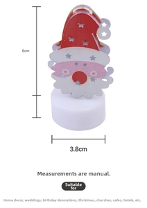 Close-up of Santa Claus LED night light showing dimensions 6cm height and 3.8cm diameter