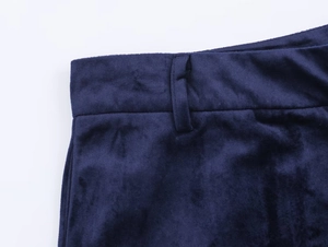 Close-up of navy blue velvet texture and waistband detail on stylish trousers
