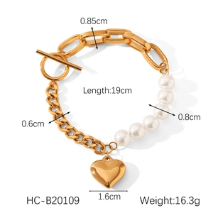 Detail view of pearl and heart pendant bracelet with size specs and metal chain dimensions