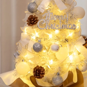 Detail of 55cm mini Christmas tree with silver ornaments, pine cones and warm lights