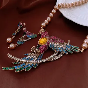 Vintage parrot jewelry set with colorful rhinestones and elegant pearls on velvet