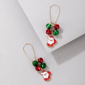 Detail of Christmas earrings featuring golden hooks with Santa Claus and colorful bell charms