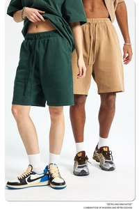 Detail shot of vintage washed 420g heavy cotton shorts in dark green and khaki colors