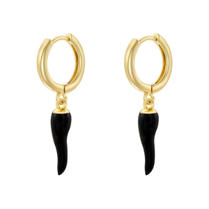 Detailed macro view of gold hoop earrings featuring black enamel chili pepper pendants