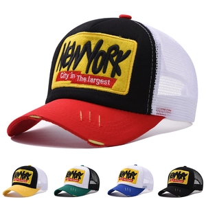 Detail of New York embroidery on a breathable mesh trucker hat with distressed brim