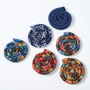 Detailed overhead view of six colorful ethnic style bendable wire hair ties for dreadlocks