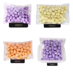 Detailed comparison of colorful speckled Easter foam eggs in four different sizes and weights