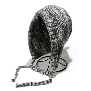 Chunky knit earflap beanie in mixed grey and white yarn with warm braided hanging straps