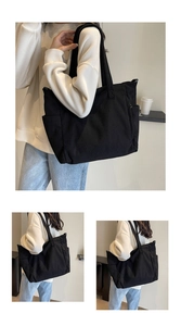 Detail of black corduroy tote bag showing ribbed texture and large capacity fit