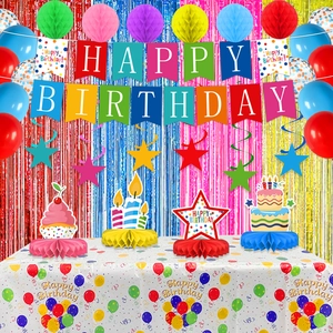 Colorful birthday party set with Happy Birthday banner, balloons and tableware