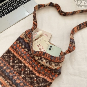 Macro detail of the plush knitted tote bag showing its texture and large capacity.