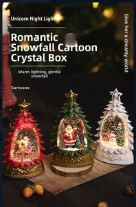 Detail of Christmas tree snow globes with Santa figures and warm glowing LED lights