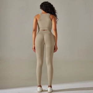 Detail of cross-back yoga bra and high-waist seamless leggings in beige workout set