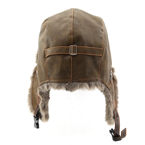 Detail view of winter pilot hat featuring dark brown faux leather and warm grey faux fur lining