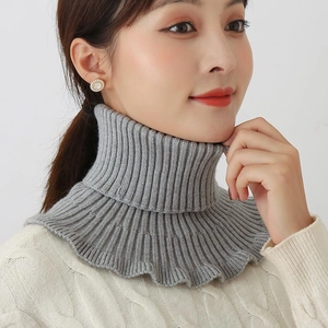 Soft grey ribbed knit turtleneck neck warmer with ruffled hem for winter warmth