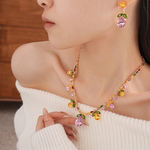 Exquisite gold necklace and earring set with pink and orange pear-shaped zircon stones
