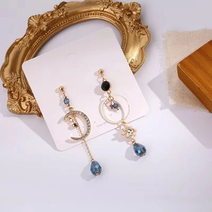 Asymmetric S925 silver blue crystal moon tassel drop earrings on vintage background