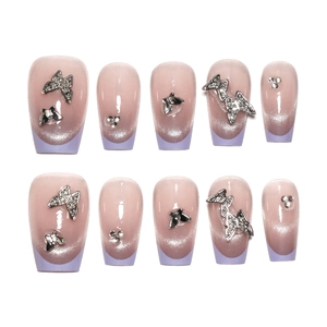 French purple cat eye press-on nails with 3D silver butterflies and rhinestones