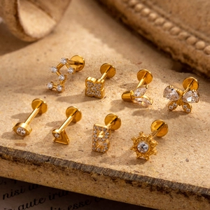 G23 titanium gold stud earrings set featuring butterfly and clover designs with zircons