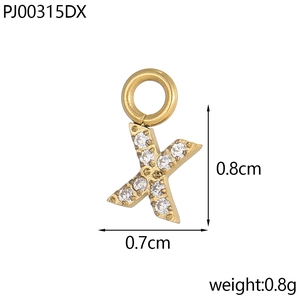 Macro detail of a gold letter X pendant with dimensions 0.8cm height and 0.7cm width