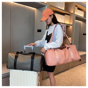 Pink and army green fitness bags with trolley sleeve and adjustable shoulder straps