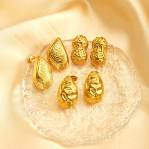 Three pairs of 18k gold-plated stainless steel textured drop earrings on silk backdrop