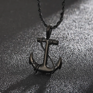 Detailed close-up of retro anchor pendant with rope details and black metal finish